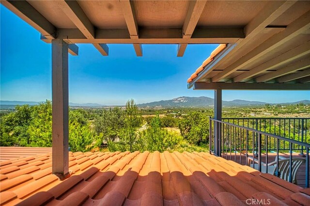 wooden terrace with a mountain view