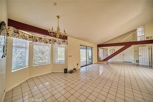 interior space with vaulted ceiling, a wealth of natural light, and an inviting chandelier