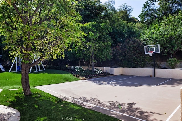 view of basketball court featuring a lawn