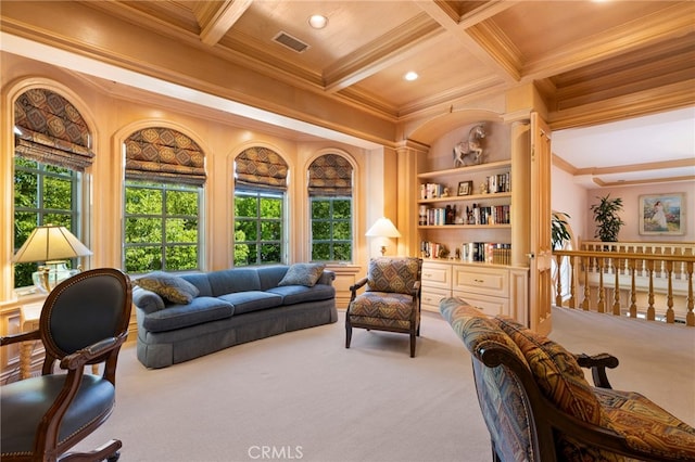 sitting room with carpet flooring, ornamental molding, a wealth of natural light, and coffered ceiling