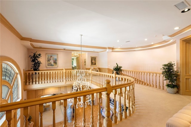 interior space with light colored carpet, crown molding, and a chandelier