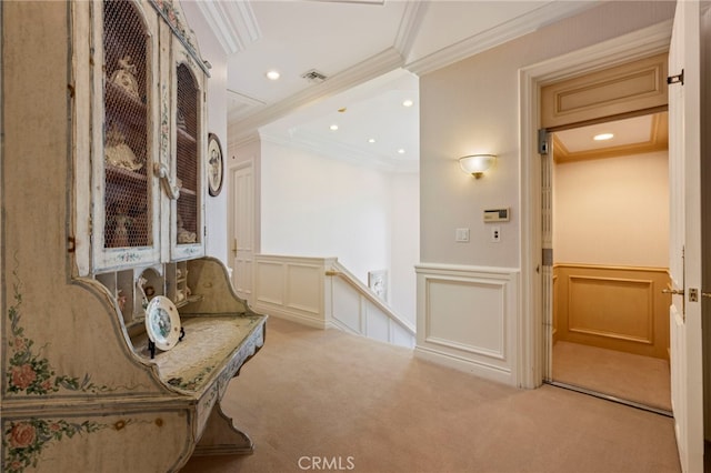 unfurnished room featuring light carpet and crown molding