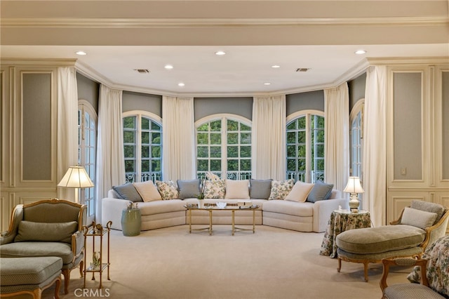 living room featuring crown molding and carpet floors