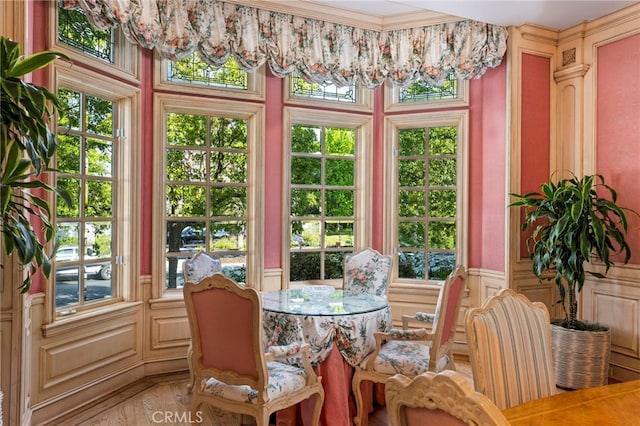 sunroom with a chandelier and a healthy amount of sunlight