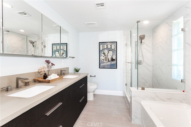 full bathroom featuring vanity, shower with separate bathtub, and toilet