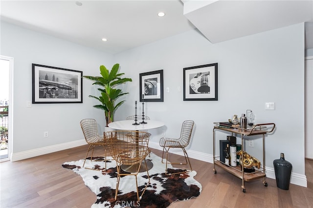 dining space featuring wood-type flooring