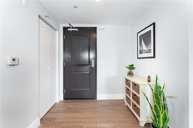 corridor featuring hardwood / wood-style floors