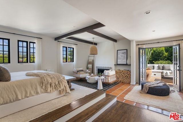 bedroom featuring beamed ceiling