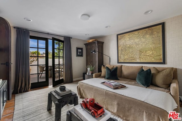 bedroom featuring access to outside and french doors