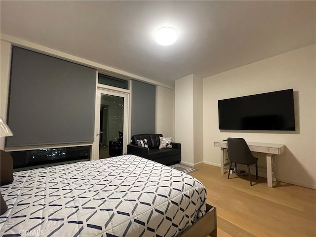 bedroom with wood-type flooring