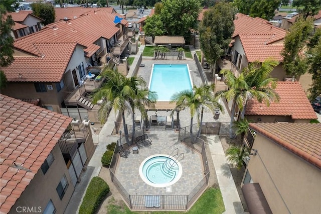 view of pool with a patio and a hot tub