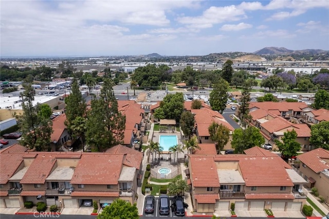 birds eye view of property with a mountain view