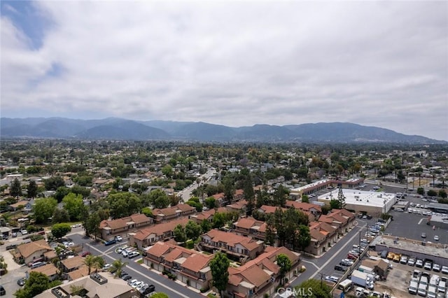 birds eye view of property with a mountain view