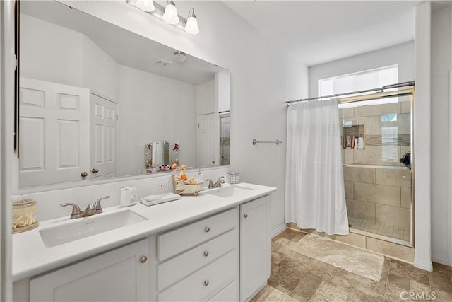 bathroom featuring vanity and a shower with shower curtain