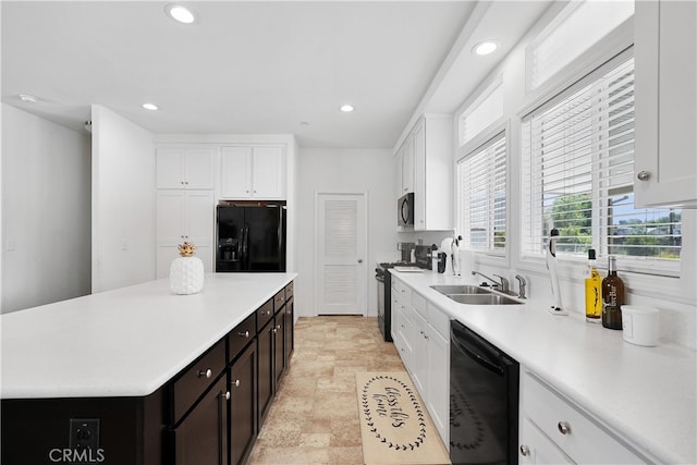 kitchen with sink, black appliances, white cabinetry, and dark brown cabinetry