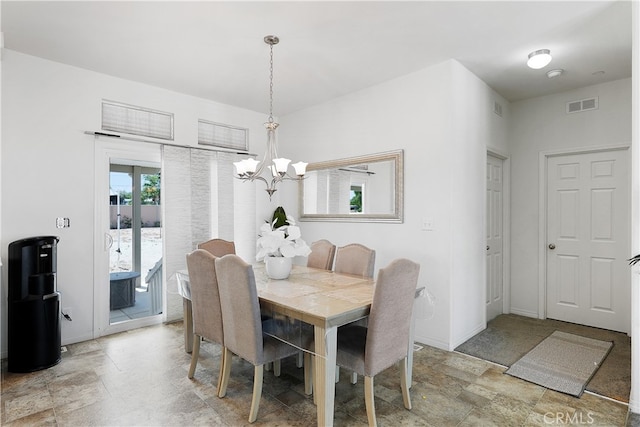 dining room featuring a chandelier