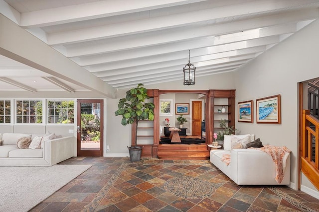 living room featuring lofted ceiling with beams