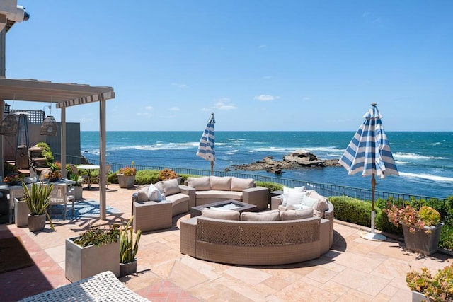 view of patio / terrace featuring an outdoor living space, a water view, and a pergola