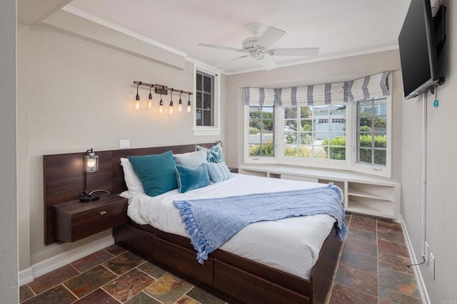 bedroom featuring ceiling fan and ornamental molding