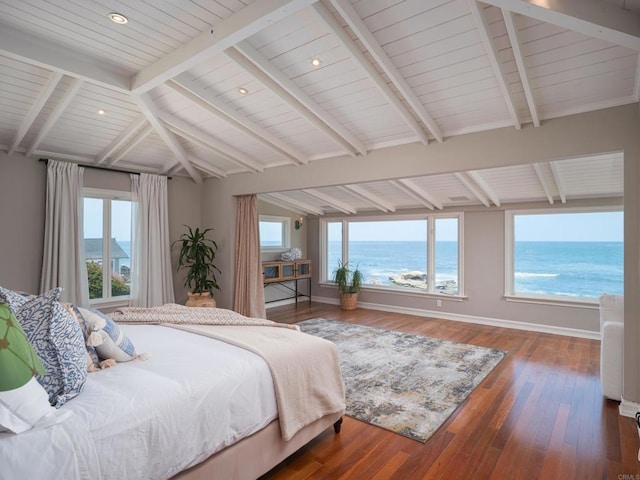 bedroom featuring lofted ceiling with beams, a view of the beach, a water view, and dark hardwood / wood-style floors