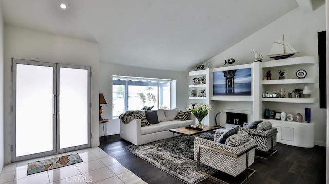 living room with wood-type flooring and vaulted ceiling