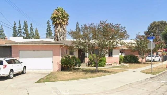 ranch-style home featuring a garage