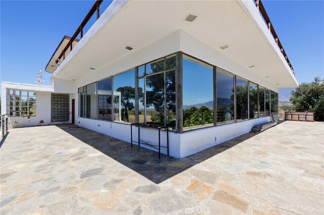 view of home's exterior featuring a patio area