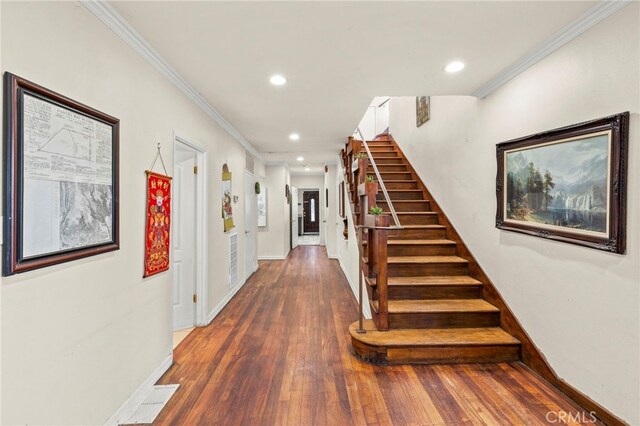 interior space featuring dark hardwood / wood-style flooring and ornamental molding