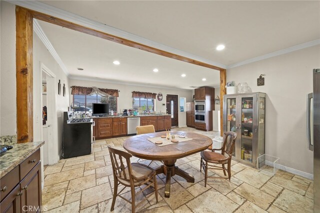 dining area featuring crown molding