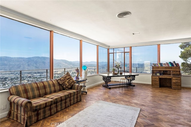 sunroom with a mountain view