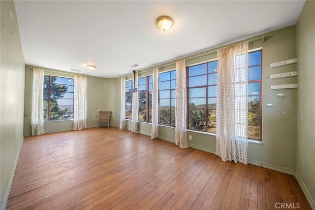 spare room featuring light hardwood / wood-style floors