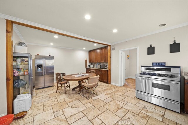 kitchen with stainless steel appliances and crown molding