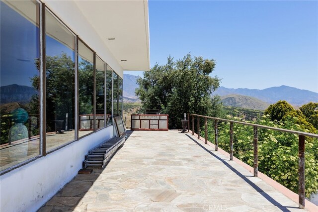 balcony featuring a mountain view