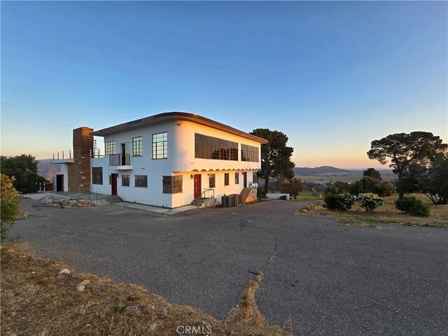 view of front of property featuring cooling unit