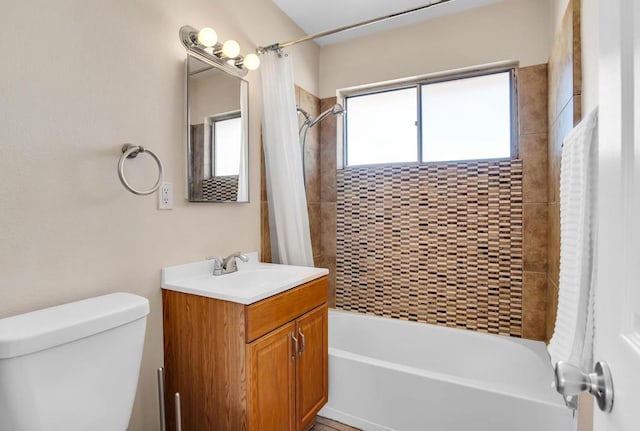 full bathroom with vanity, toilet, and shower / tub combo with curtain