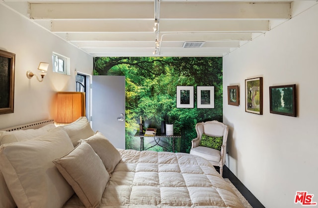 bedroom featuring beamed ceiling