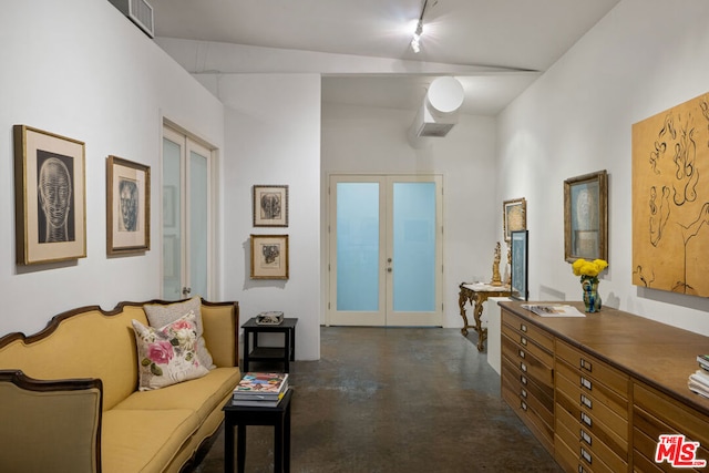 interior space with french doors and lofted ceiling