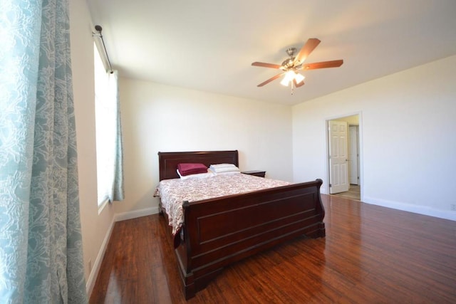 bedroom featuring ceiling fan and dark hardwood / wood-style flooring