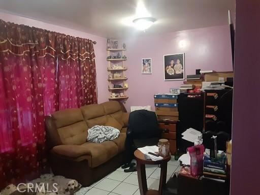 home office with tile patterned flooring