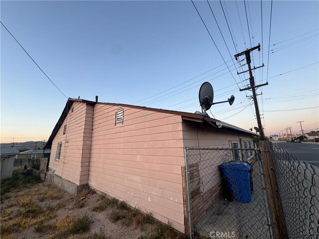 view of property exterior at dusk