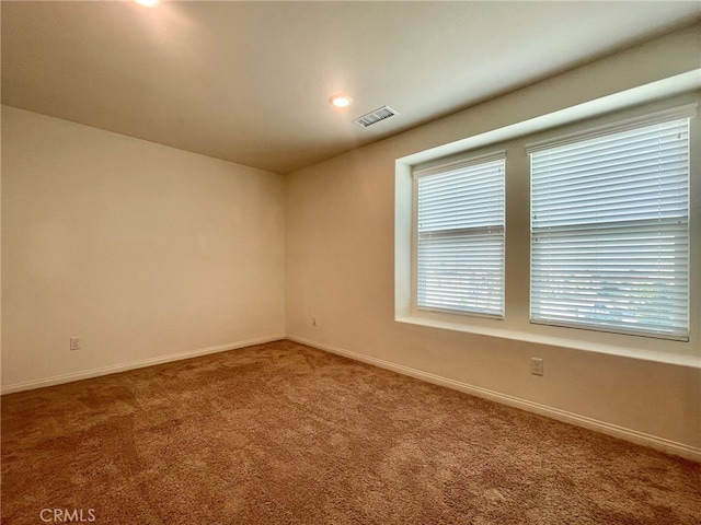 view of carpeted spare room