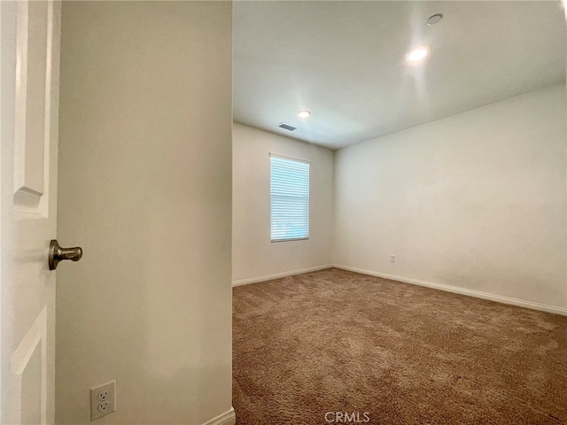 empty room with carpet flooring