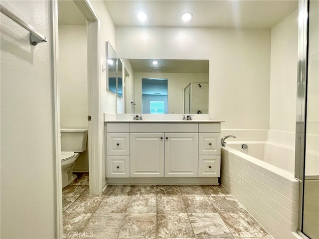 full bathroom with vanity, plus walk in shower, and toilet