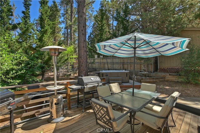 wooden deck featuring a hot tub