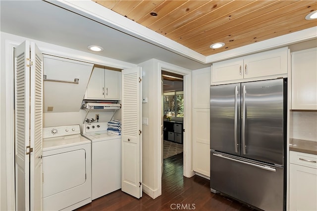 washroom featuring wooden ceiling, dark wood-type flooring, and separate washer and dryer