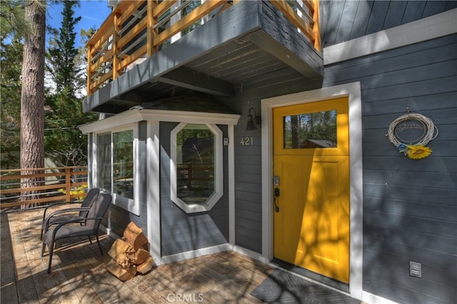 entrance to property with a wooden deck