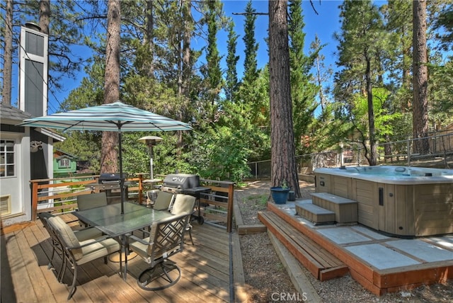 deck featuring a hot tub