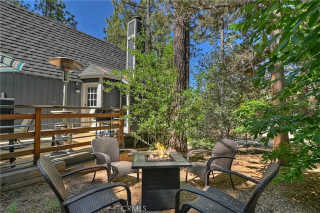 view of patio featuring an outdoor fire pit