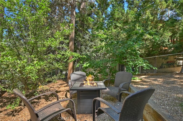 view of patio featuring an outdoor fire pit