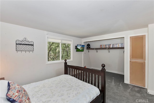 bedroom featuring dark carpet and a closet